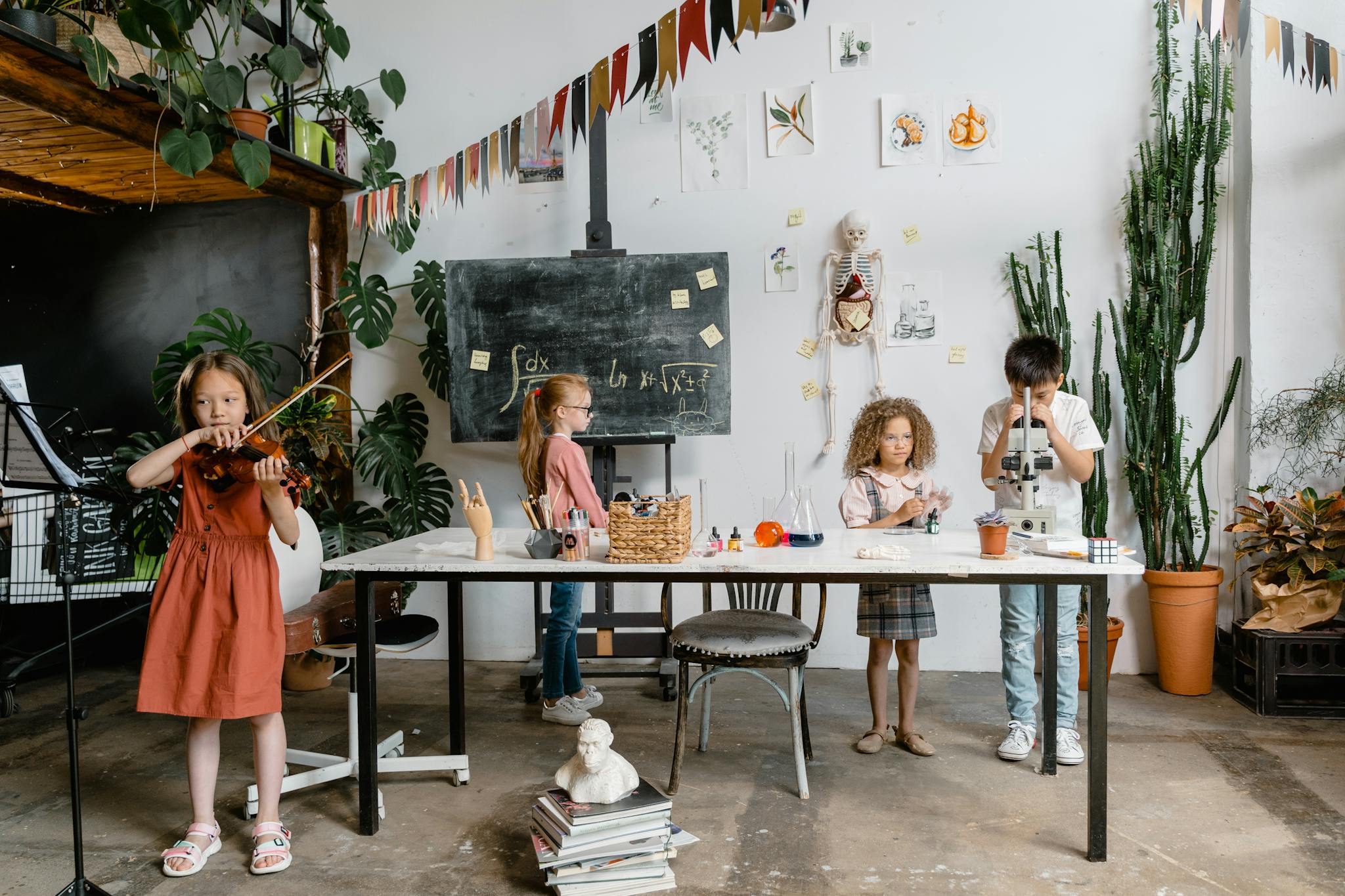 Children engaged in creative learning with music, science, and art in a vibrant classroom setting.